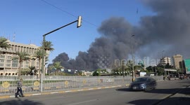 Iraqi firefighters put out fire in Baghdad