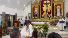 Young altar server reacts to couple’s kiss at wedding in San Pablo City