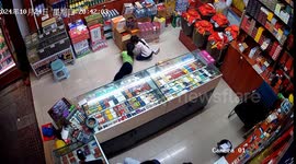 Skin-crawling moment rat crawls up girl's jumper whilst playing on shop floor in China