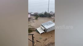 Truck submerged in muddy flash flood during Tropical Storm Trami