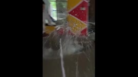 Residents seen swimming in floodwaters after Typhoon Kristine in Camarines Sur