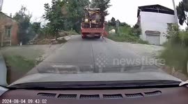 China: A Sliding Down Cargo Almost Hits the Next Car