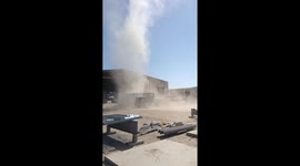 Workers Get Caught in a Dust Devil