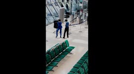 Airport staff practice their dance routine