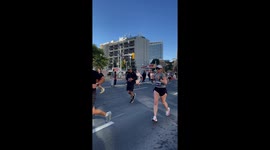 Attempting to Cross the Street During a Marathon