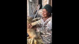 A joyful moment: mother sings and plays with cat in Yogyakarta