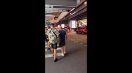 Halloween vampire directs traffic outside shopping mall