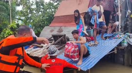 Philippine Coast Guard rescue baby from Tropical Storm Trami flood