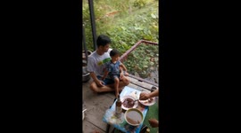 Selfie net snaps plunging father and son into pond