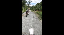 Biker falls into unexpected road hole in Kathmandu, Nepal