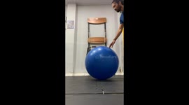Jumping on an exercise balloon ends in a fall