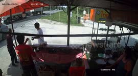 Motorcycle rider narrowly avoids falling under wheels of oncoming lorry