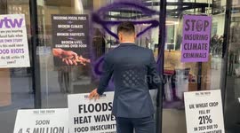 Police arrest Extinction Rebellion activists as they spray-paint insurance company offices