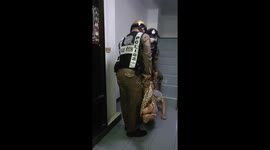 Helpful police officers carry drunk reveller back to his room