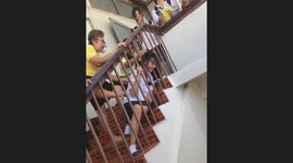 Schoolgirl gets her head stuck in wooden stair railings