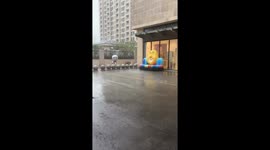 Mascot slips in rain during typhoon in Suzhou