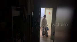 Masked person startles two ladies in Shanghai