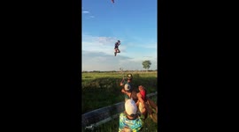 People ride dragon kites in Lampung, Indonesia