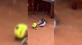 Spain: Rescue of a woman in Valencia, Spain, who had been trapped in her wooden house with her pets after the severe flooding