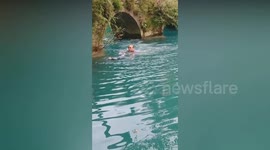 Heroic bystander saves little girl from drowning in river