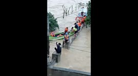 Rescue people whose boat capsized while moving out of flooded area