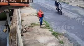 Panicked woman mistakes bikers for robbers and throws bag over wall