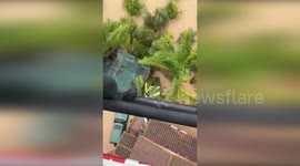 Helicopter rescues stranded residents from roofs in Malaga, Spain