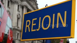 A sign near parliament that says 'REJOIN', London, United Kingdom