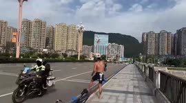 Cyclist detained by police after mooning fellow competitors in shocking race stunt