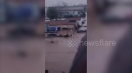 Footage shows vehicles and streets submerged in floodwater in Spain