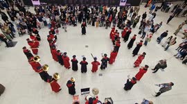 The Band of the Household Cavalry entertain travellers in Waterloo Station on Poppy Day in London