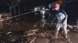 Emergency personnel work in a flooded area after heavy rains caused flooding in Utiel, Spain, November 1.