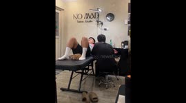 Tattoo studio cat Noma comforts clients in Malolos, Philippines