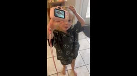 Exclusive- Toddler photographer proudly captures family dog's 'artful' side