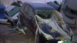 Hundreds of vehicles left mangled and wrecked by deadly floods in Spain's Valencia region