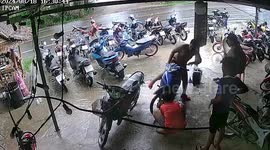 Motorcycle catches fire while being repaired outside shop
