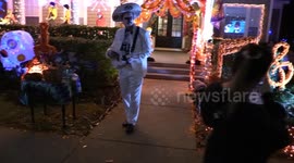 US: People stroll through Celebration where many houses were decorated for Halloween