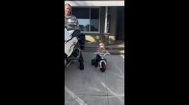 Exclusive- Like father, like son: Little “deputy” hits the road on Halloween