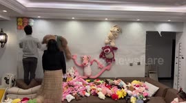Parents lovingly make 'wall of dolls' surprise for daughter