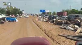 Hurricane Dana leaves streets filled with mud and displaced cars in La Pista de Silla
