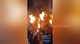 Diwali worshippers wave fire torches in India