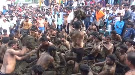 A unique festival, where participants throw cow dung at each other, was held in Kumtapuram village near Thalavadi in South India.