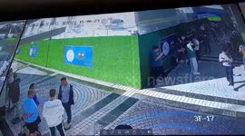 Window falling from high-rise narrowly misses crowd standing below