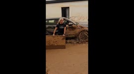 Residents of Paiporta clean streets after flooding