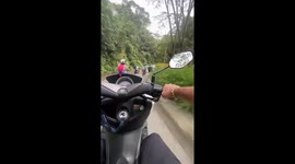 Motorcycle mishap captured on video in Colombia