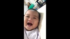 Baby's adorable vampire teeth charm in San Juan, Bulacan