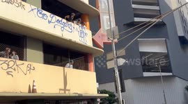 Dodger fan vandalizing parking structure after parade.