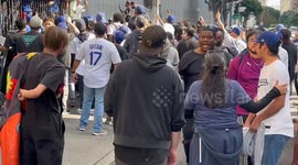Dodger fan vandalizing parking structure after parade.
