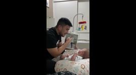 Dad Shows Baby Family Photo