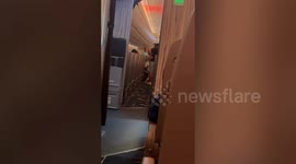 Flight attendant kneels to apologise to 'stroppy business class passenger' for typhoon